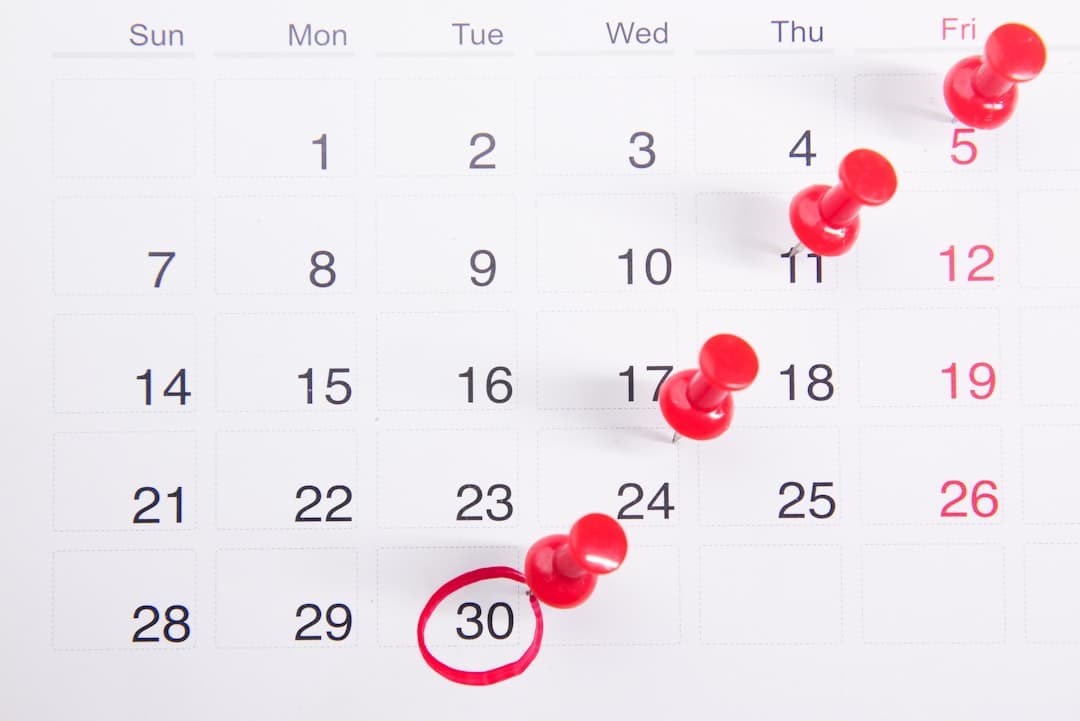 A therapist planning content on a calendar, emphasizing the need for organized scheduling in content marketing.