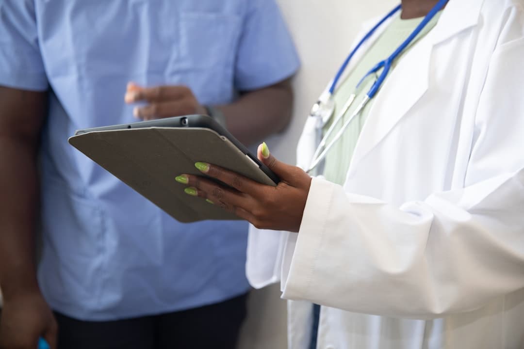 A team of healthcare professionals discussing strategies to streamline the therapy intake process in a modern office.