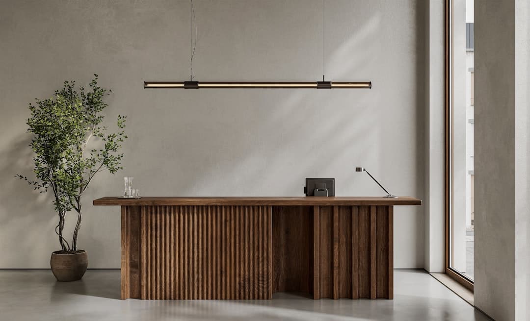 Clinic receptionist desk in natural light representing intake capacity when hiring for private practice growth
