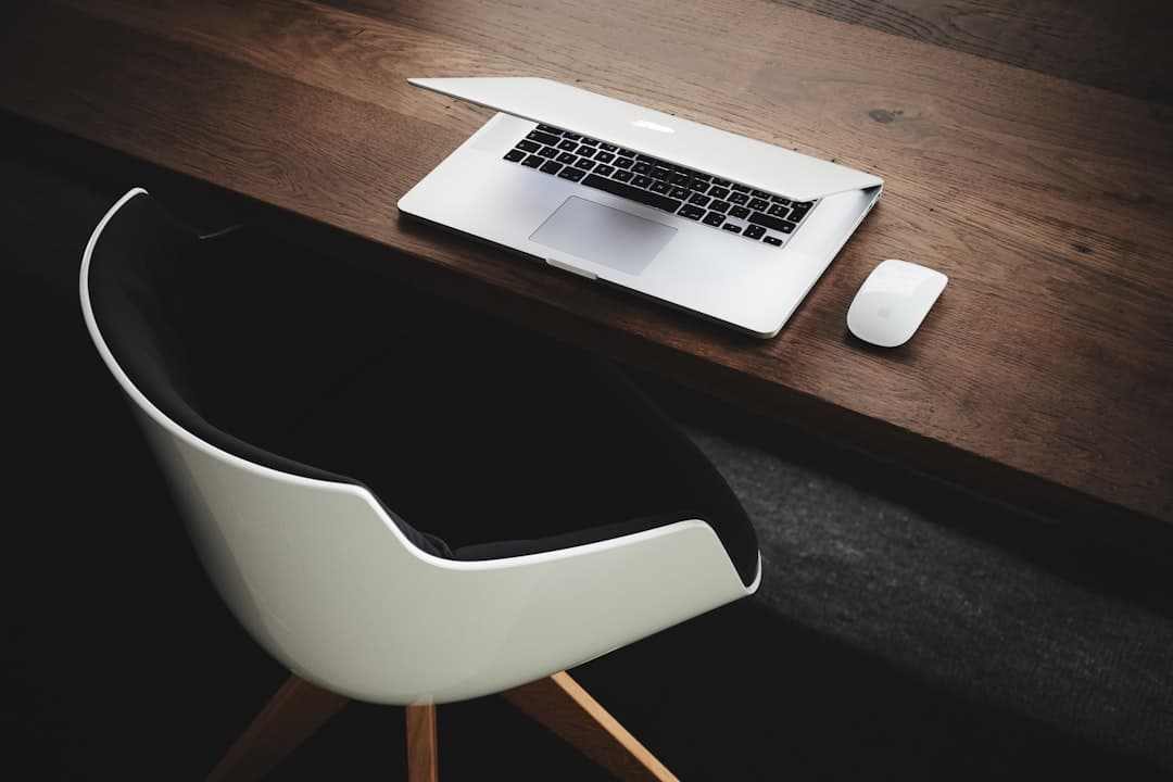 A therapist working on a laptop in a calm office setting, ideal for showcasing LinkedIn marketing strategies.