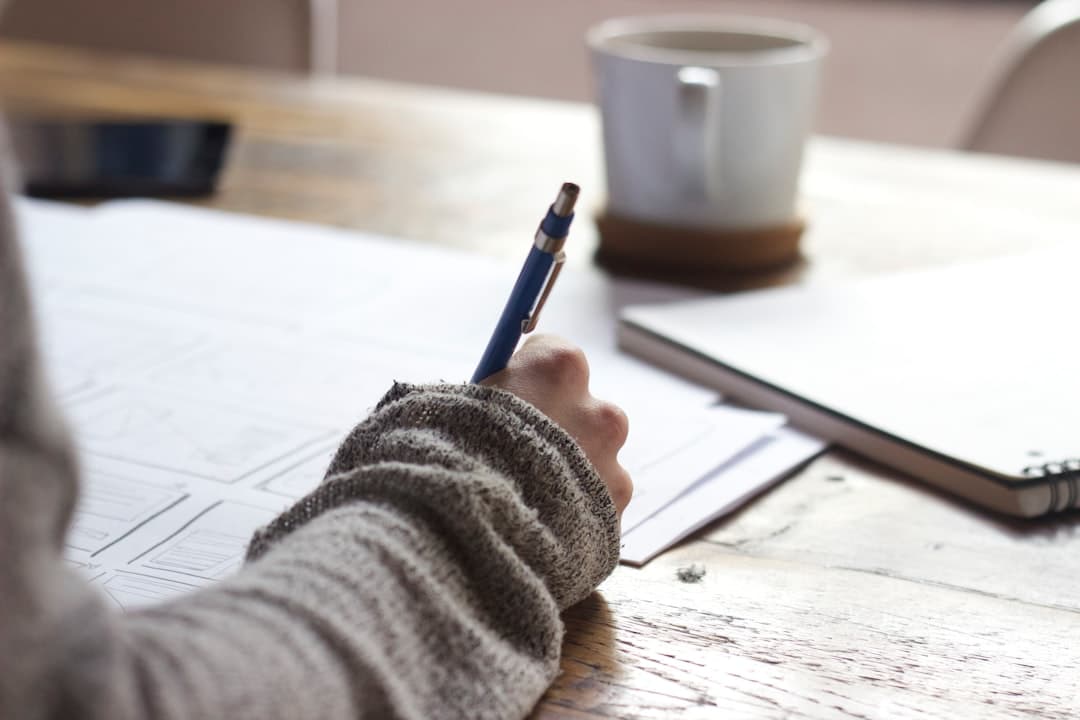 A therapist taking notes in an office, symbolizing the creation of credible content for LinkedIn.