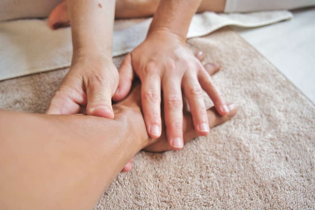A client receiving a relaxing massage, illustrating the importance of client retention and rebooking strategies.