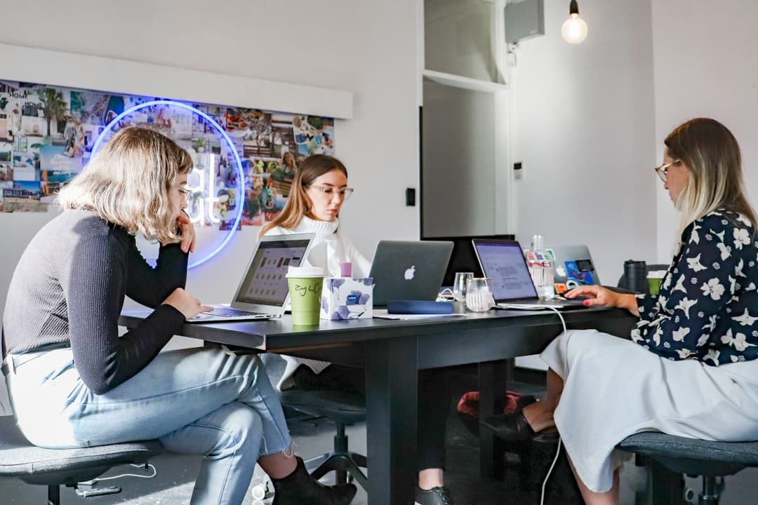 A modern office space with marketing professionals collaborating, illustrating when a marketing agency is the right choice.